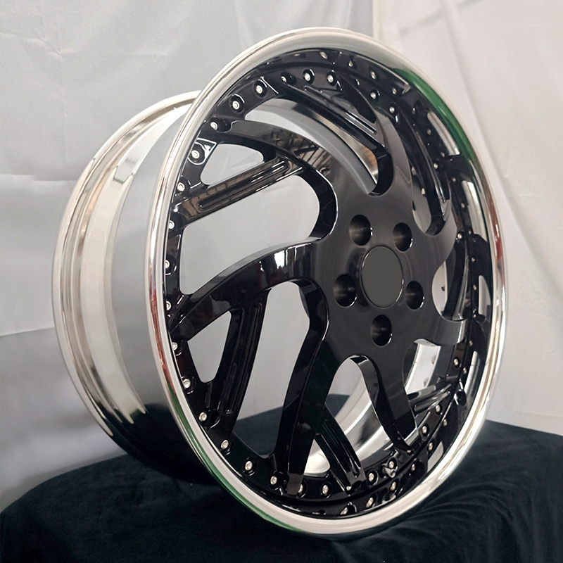 Black multi-spoke forged wheel with polished outer lip, three-quarter view